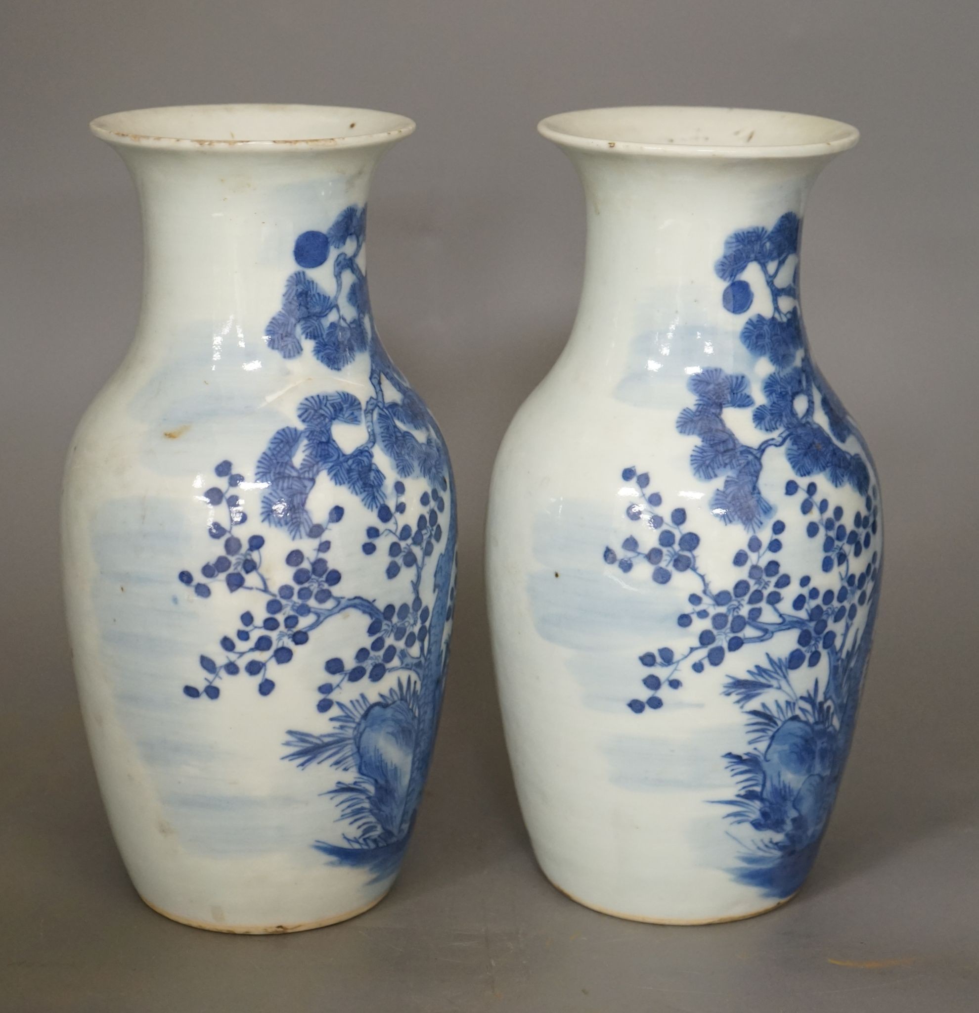 A pair of 19th century Chinese blue and white three friends of winter vases 22cm